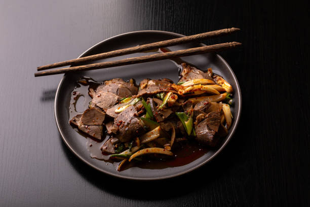 istock Chinese food: spicy salad with beef on a brown plate 1176625333