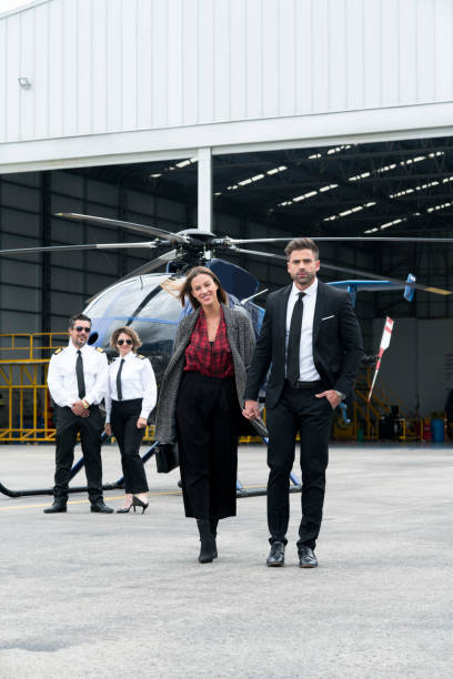 istock Couple getting off their helicopter 1176625343
