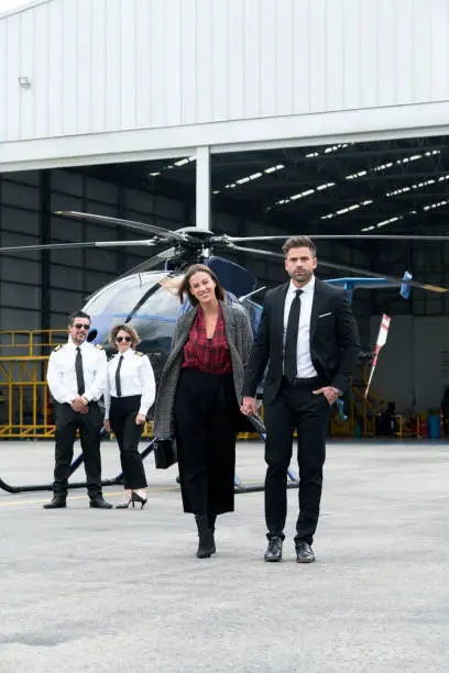 Photo of Couple getting off their helicopter