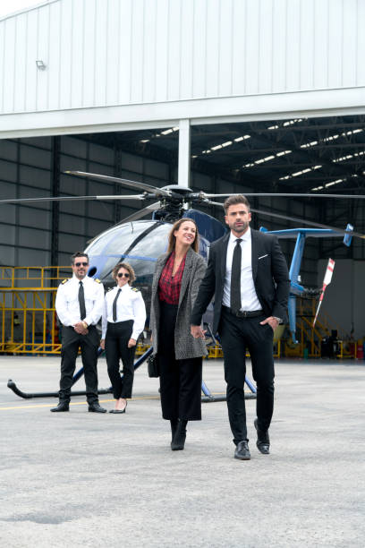 istock Couple getting off their helicopter 1176625399