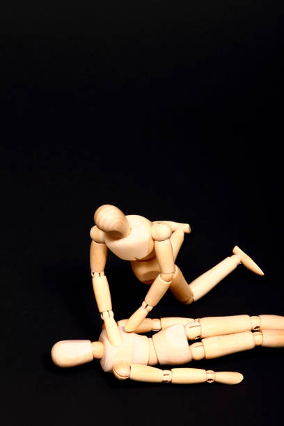 istock Wooden manikins administering CPR resuscitation 1176627351
