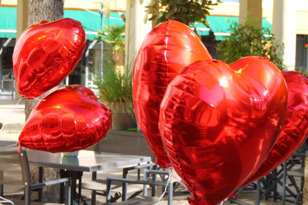 istock Red shiny balloons in heart shape. 1176628522