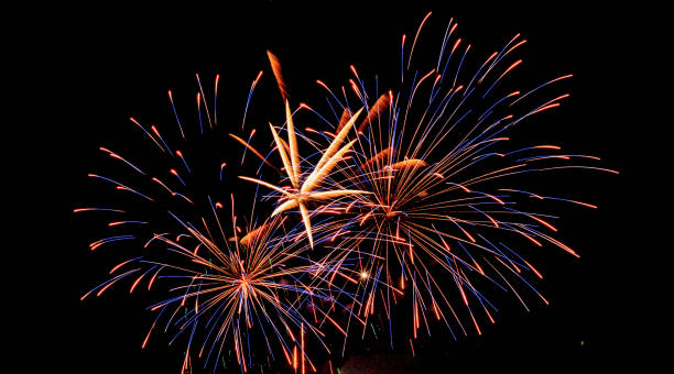 istock Brightly Colorful Fireworks isolated black background. New Year celebration fireworks. 1176628581