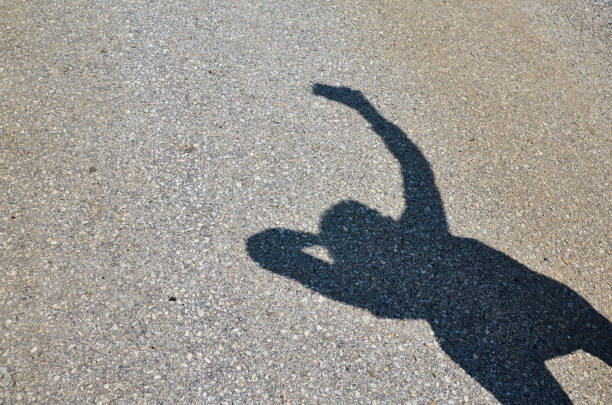 istock Shadow of a woman while taking selfie 1176631508