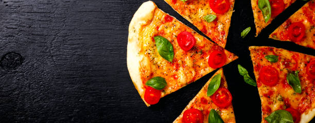 istock Pizza Margarita with Mozzarella and Basil on the Black Background Bake Snack with Tomatoes  Top View Copy space for Text 1176632773
