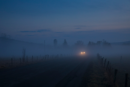 A warm winter's fog haunts the landscape of Jenksville, a small rural town in New York State, consisting of farms, open air,  two-lane country roads and headlights in the distant.