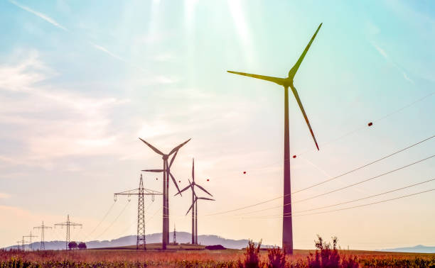 istock Wind turbines with power line in the sunset 1176636100