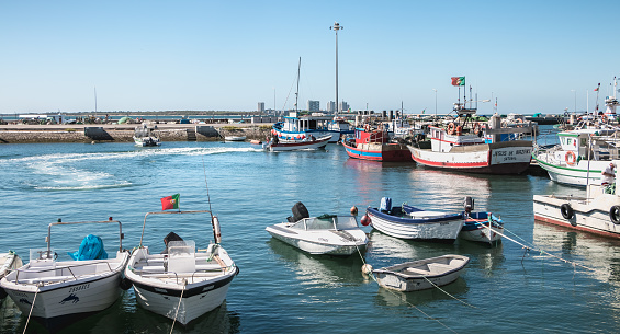 Setubal, Portugal - August 8, 2018: View of Setubal fishing port and its fishing boats on a summer day
