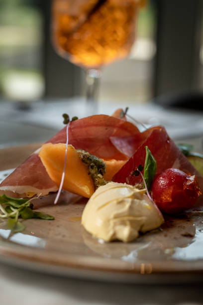 istock Plate with delicious cantaloupe, prosciutto and tomato 1176639380