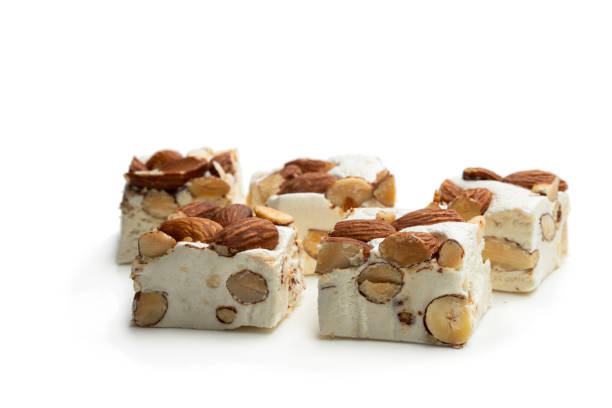 istock Homemade nougat bar with almonds isolated on white 1176640961