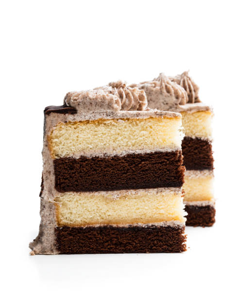 istock Pieces of layered sponge cake with cookie crumb isolated on white 1176641696