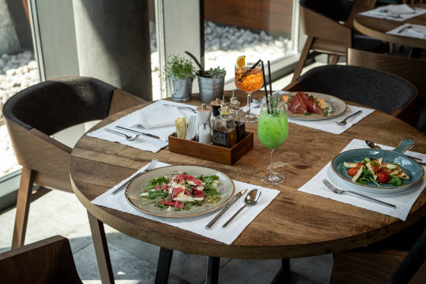 istock Plate on table with delicious beef carpaccio and grilled halloumi chesse 1176642363