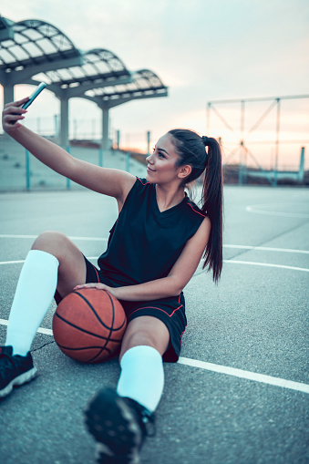Female Taking Selfie In Basketball Field Stock Photo - Download Image Now -  Basketball - Ball, Beauty, Cheerful - iStock