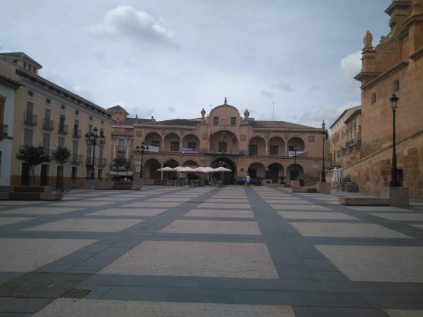 Wide and long square in Lorca city, Murcia province, Spain, called Plaza de España in Spanish, with the town hall at background. Lorca, Murcia, Spain; on September 08, 2019: Wide and long square in Lorca city, Murcia province, Spain, called Spain Square, Plaza de España in Spanish, with the town hall at background. lorca stock pictures, royalty-free photos & images