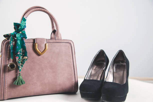 istock woman shoes with bag 1176644360