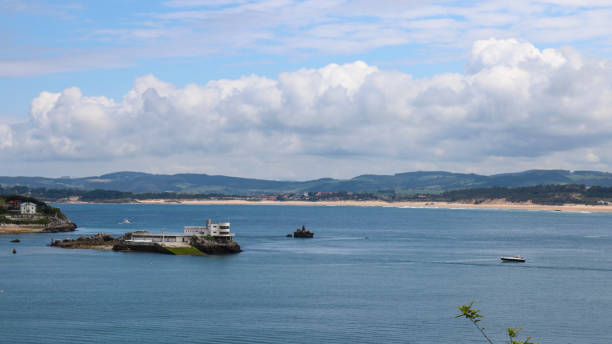 Tower island in a day with some white clouds, Santander, Cantabria, Spain.
