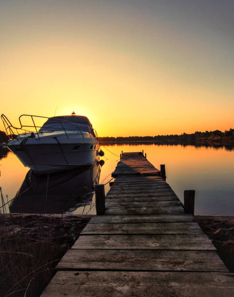 istock Boat near a pier at sunrise 1176646863