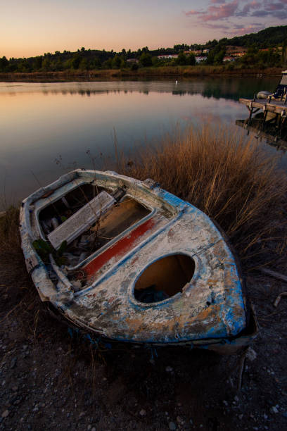 istock Shipwreck on the shore of a lake 1176646906