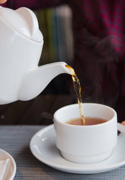 istock tea with lemon cafe white cup saucer 1176649081