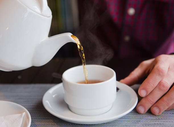 istock tea with lemon cafe white cup saucer 1176649083