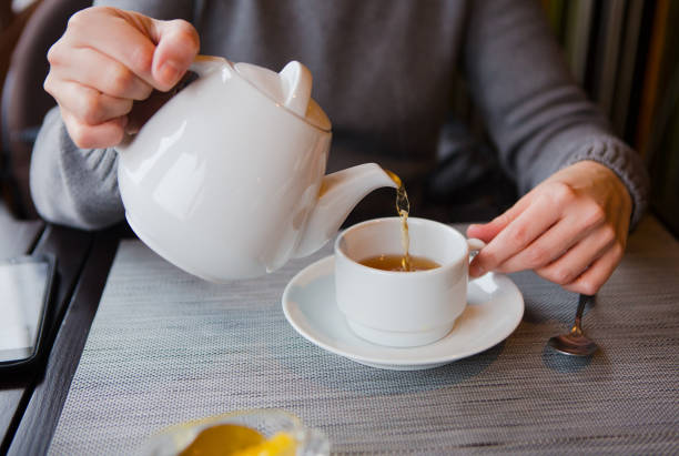 istock tea with lemon cafe white cup saucer 1176649092