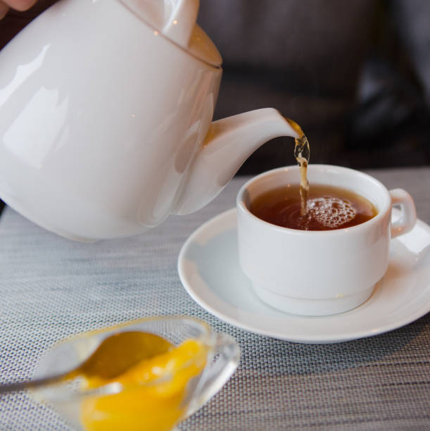 istock tea with lemon cafe white cup saucer 1176649096