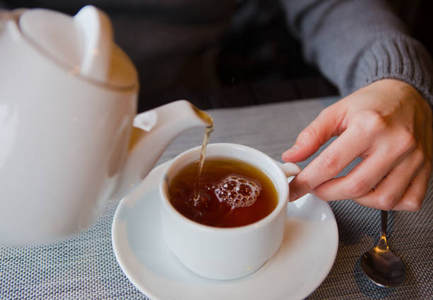 istock tea with lemon cafe white cup saucer 1176649122