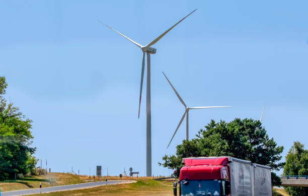 istock Wind turbines with power line in the sunset 1176649142