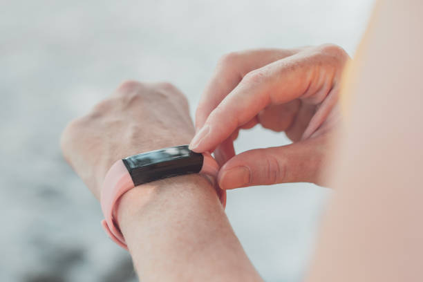 istock Woman hiker using smart bracelet during trekking in nature 1176649528
