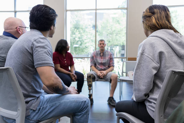 istock Veteran with prosthetic leg shares during support group 1176649739