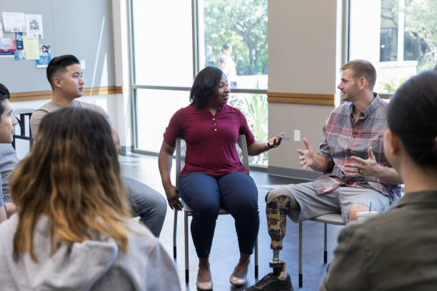 istock Female veteran discusses experiences with other veterans 1176649741