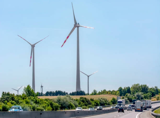 istock Wind turbines with power line in the sunset 1176649887