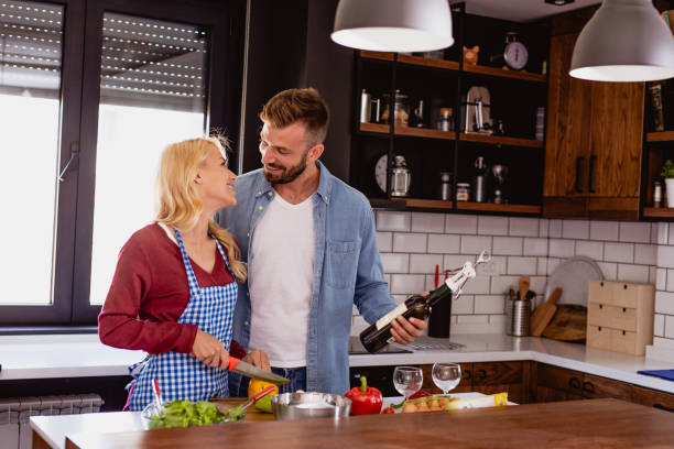 istock Young couple is preparing lunch in the kitchen 1176650613