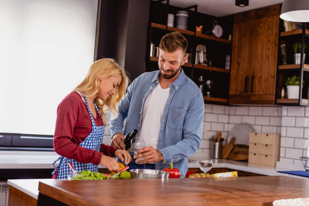 istock Young couple is preparing lunch in the kitchen 1176650680