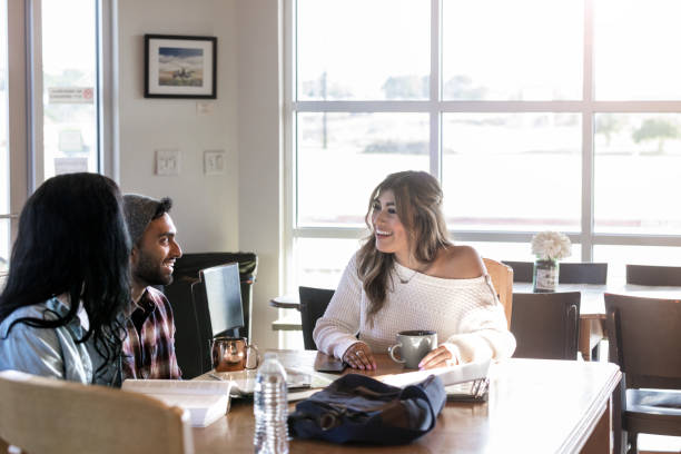 istock Diverse friends take a break from studying to laugh 1176650738