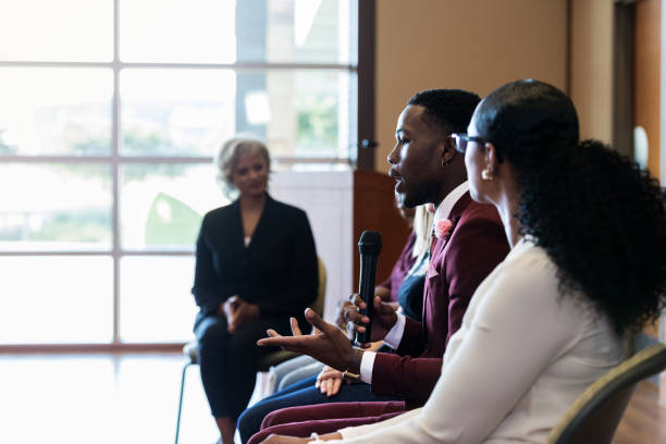 istock Young business professional discusses an issue during conference 1176650835