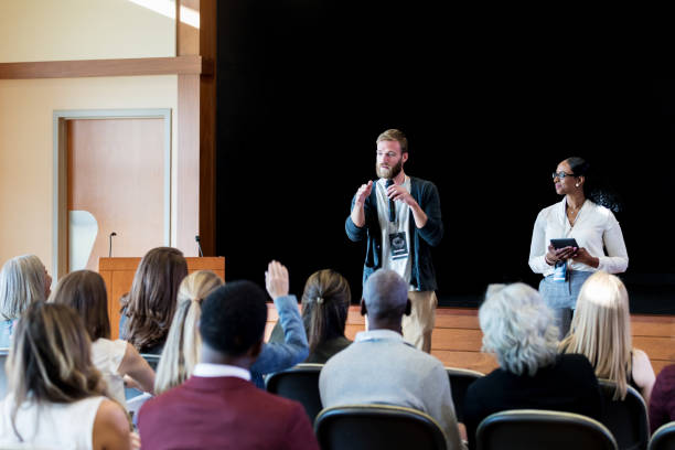 istock Millennial businessman speaking during conference 1176650862