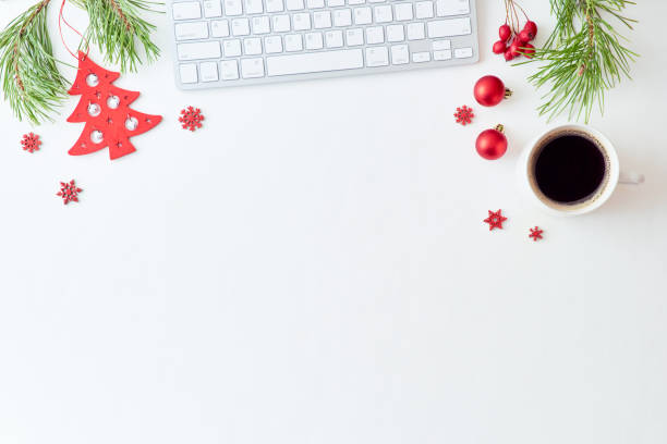 istock Flat lay christmas home office desk with pine branches and keyboard, christmas decorations  on a white background 1176651288