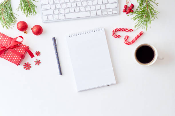 istock Mockup white notebook with pine branches and keyboard, christmas decorations  on a white background 1176651295