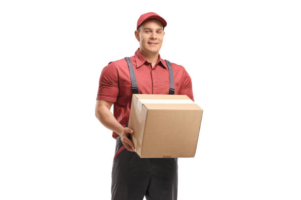 istock Male worker holding a cardboard package 1176652638
