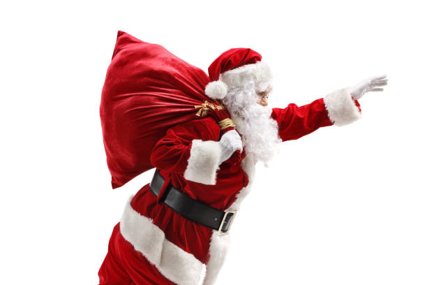 istock Santa Claus carrying a sac and gesturing with hand 1176652646