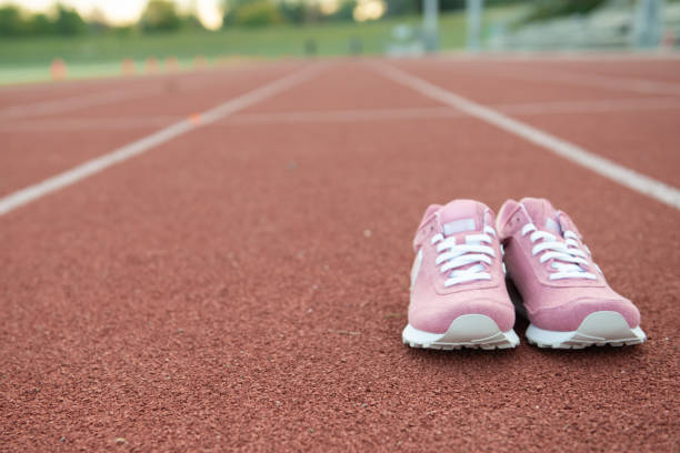 istock Running shoes on the track 1176661725