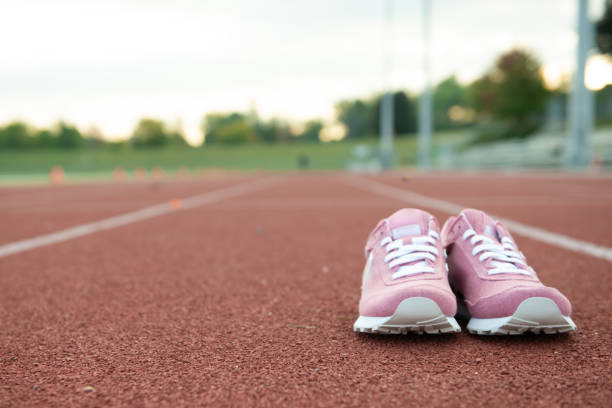 istock Running shoes on the track 1176661736
