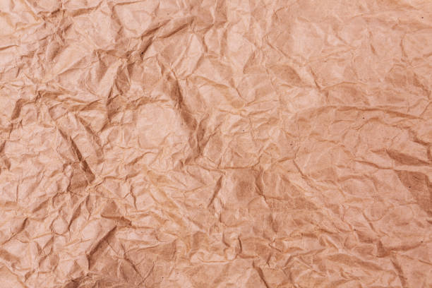 istock High detailed abstract crumpled packaging paper texture background for your design. 1176662352