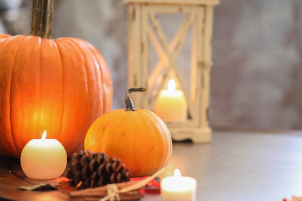istock Halloween, autumn scene with pumpkins and candles. 1176662426