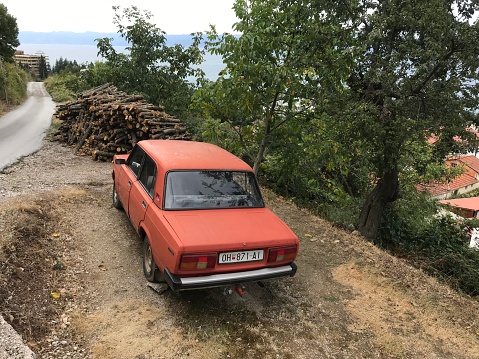 Ohrid, Macedonia, - September 21, 2019. Vintage car wreck in the country side.