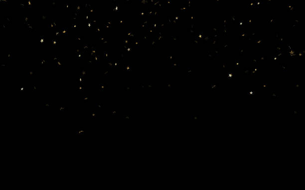 istock Gold Colored Star Shaped Paper Confetti Falling on Black Background 1176669072
