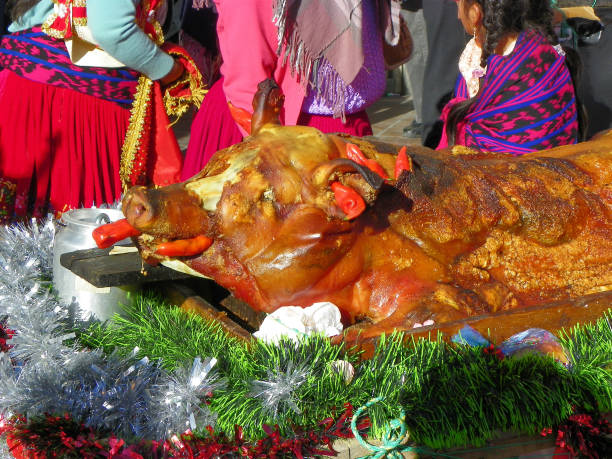 porc rôti décoré pour le défilé, equateur - char grilled photos et images de collection