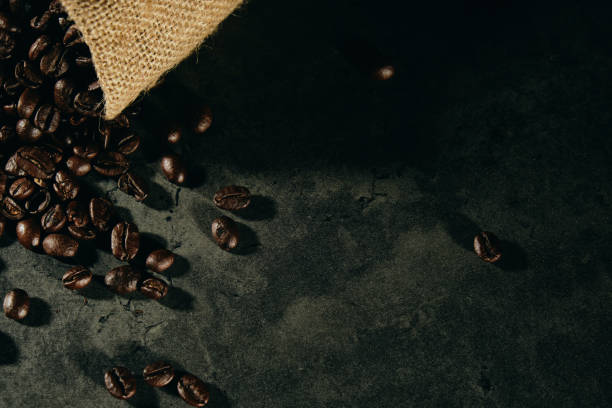 istock Cup of coffee and coffee background 1176671709
