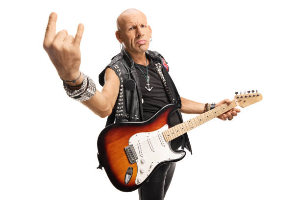 istock Male rock star with a guitar gesturing rock and roll sign 1176672795
